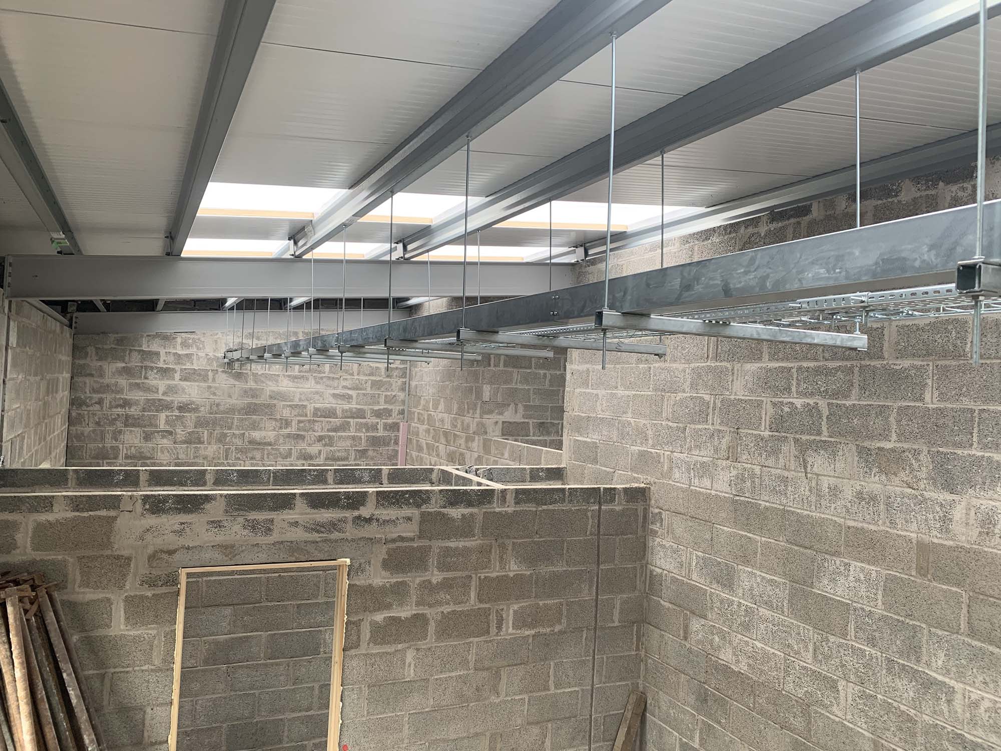 Metal brackets for lighting systems