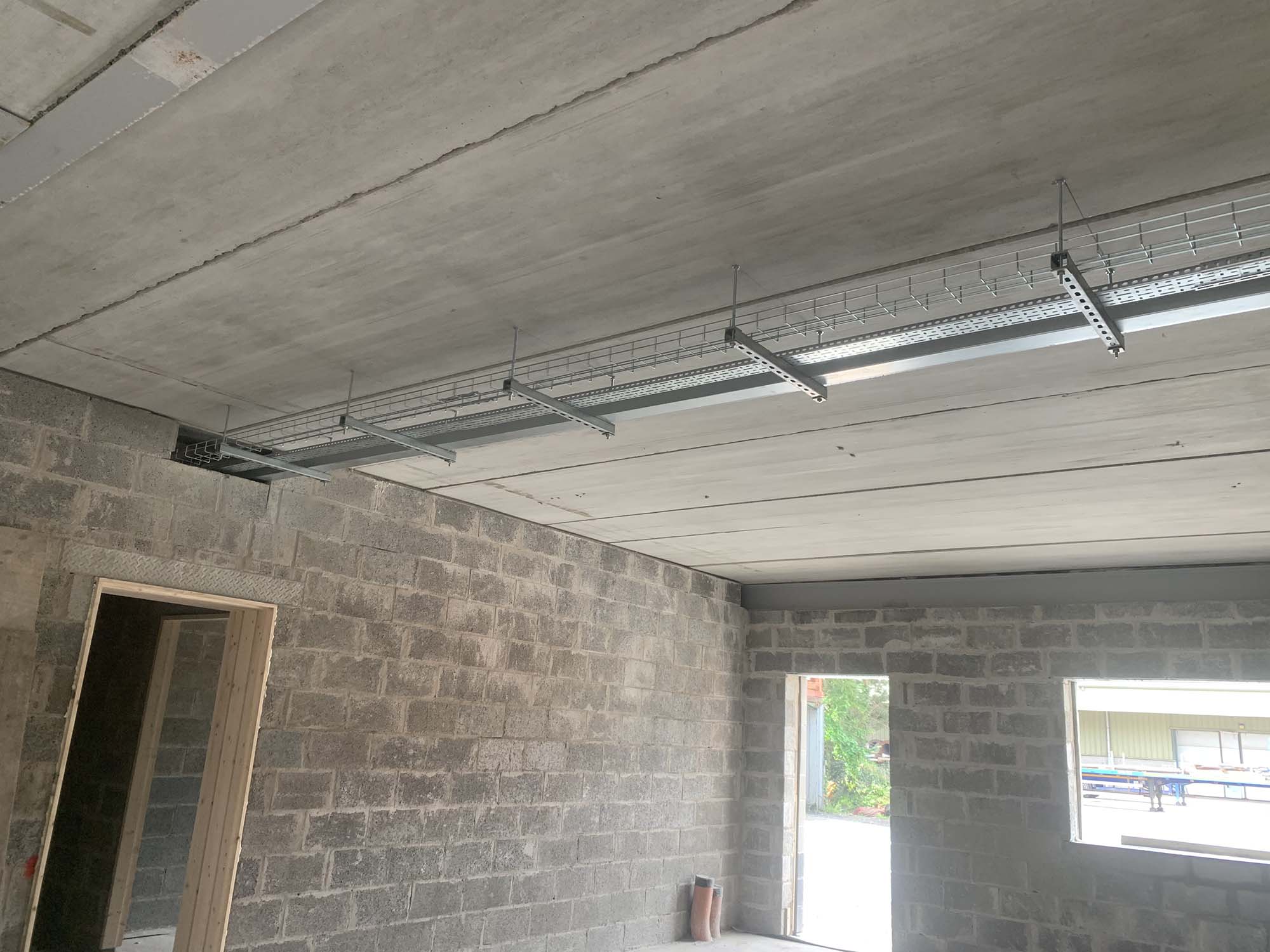 overhead metal casing enclosed wiring