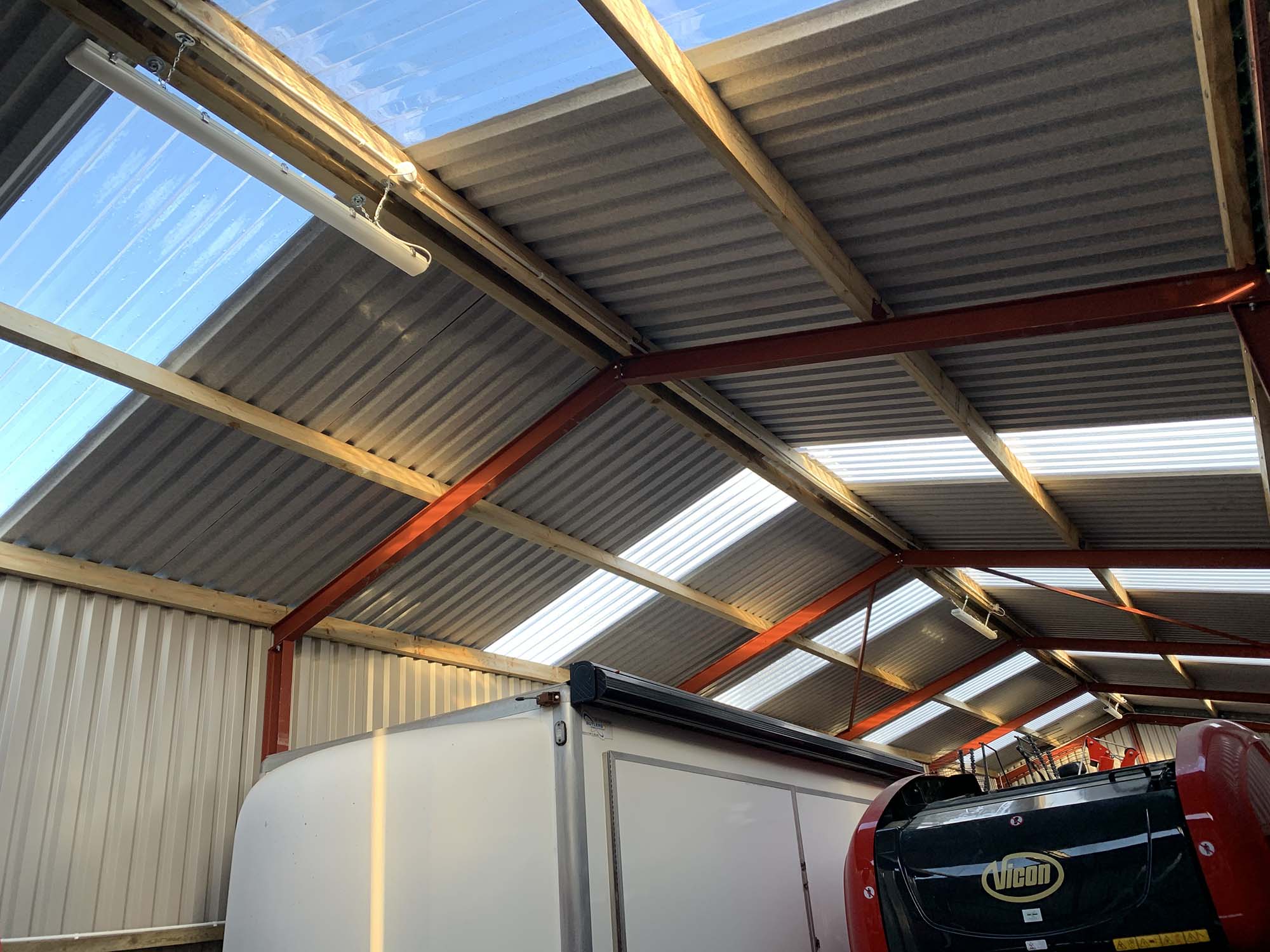 Steel beam roofing system inside steel building
