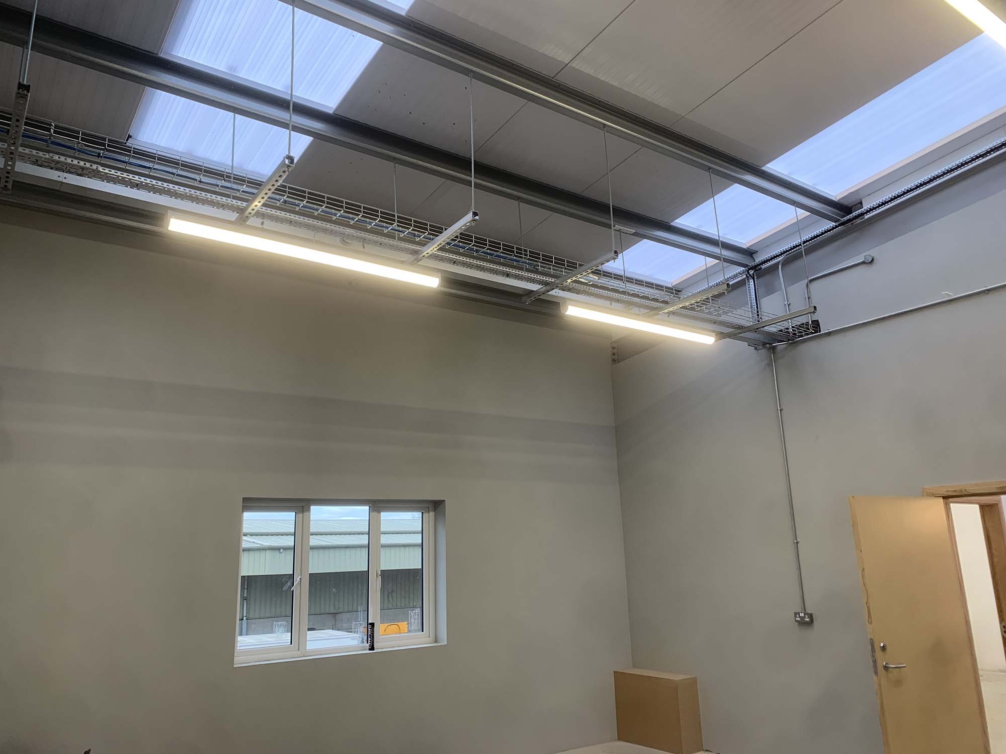 overhead metal casing enclosed wiring