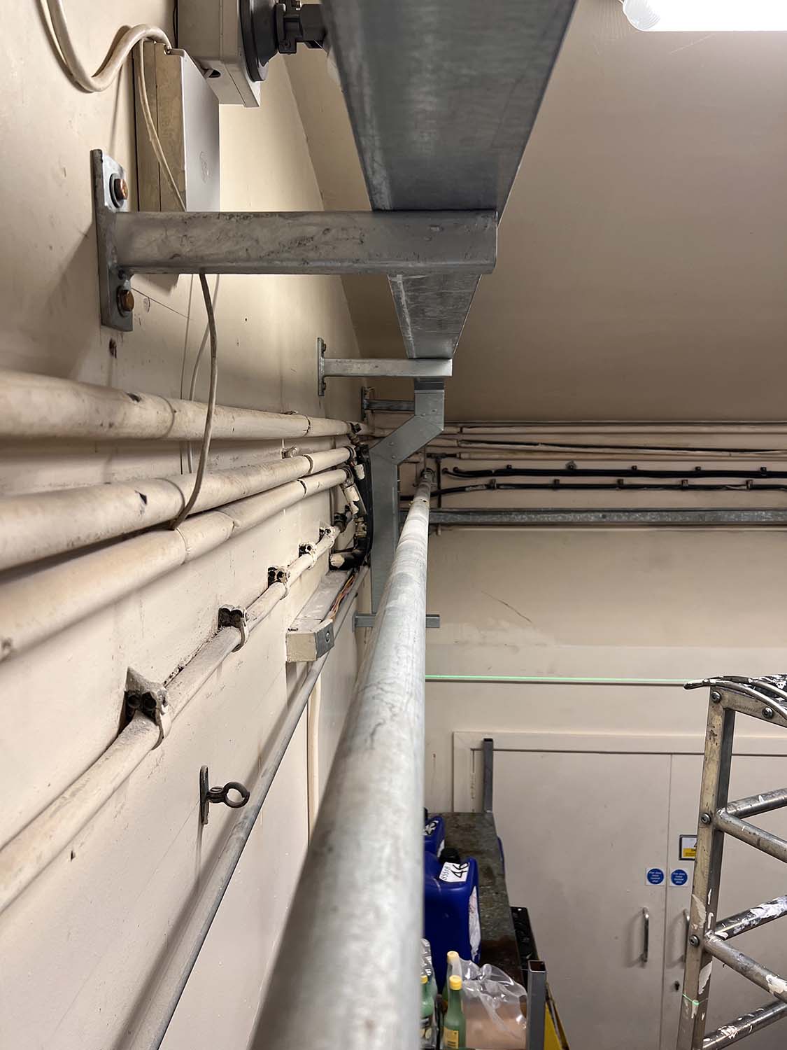 overhead metal casing enclosed wiring